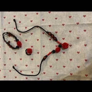 Set of rose styled necklace, ring and bracelet